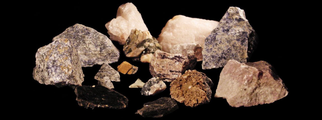 Minerals collected at the Princess Sodalite Mine Rock Farm including rose quartz, blue sodalite, calcite, diopside, mica