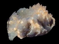 Colemanite, calcite, US Borax Mine, Boron, California (longwave UV)
