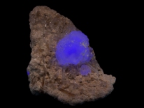 Blue fluorite on quartz, Pasta Bueno, Peru (longwave UV)
