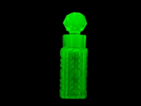 Cut uranium glass perfume bottle, post Civil War (longwave UV)