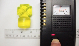 Uranium glass stopper about 1 inch from Geiger counter beta slots