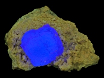 Blue fluorite on quartz crystals - Pasta Bueno, Peru (longwave UV)
