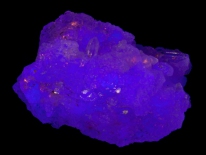 Fluorite, quartz - Mundo Nuevo Mine, Santiago de Chuco Province, La Libertad Department, Peru (longwave UV)